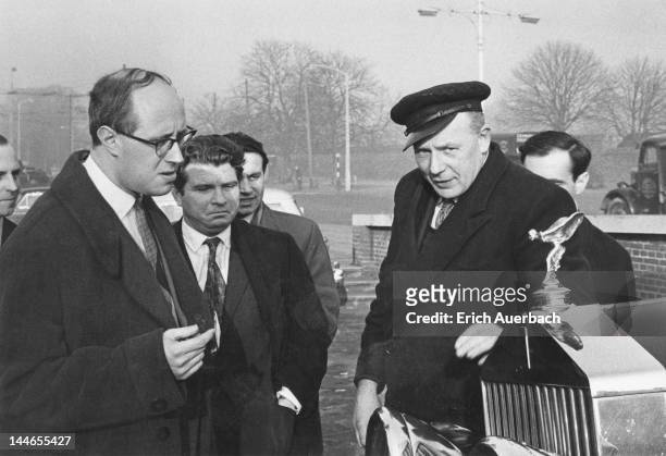 Soviet musicians, cellist Mstislav Rostropovich and pianist Emil Gilels with a chauffeur and his Rolls-Royce outside Hampton Court Palace, London,...