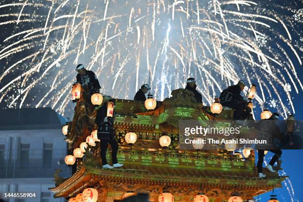 Fireworks explode above illuminated floats during the Chichibu Yomatsuri, or Chichibu Night Festival on December 3, 2022 in Chichibu, Saitama, Japan.