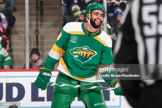 Jordan Greenway of the Minnesota Wild talks with a teammate during a break in the game against the Winnipeg Jets at the Xcel Energy Center on...