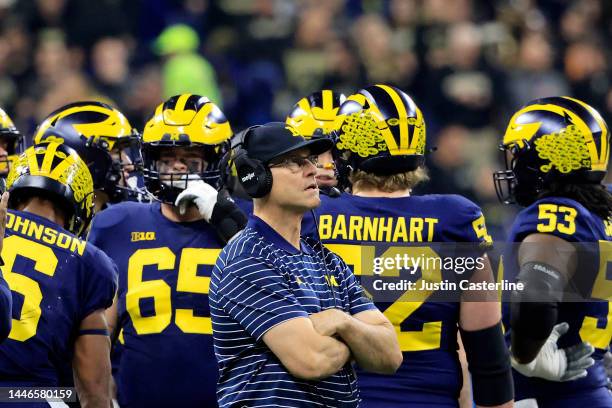 Head coach Jim Harbaugh of the Michigan Wolverines looks on during the first half in the Big Ten Championship game against the Purdue Boilermakers at...