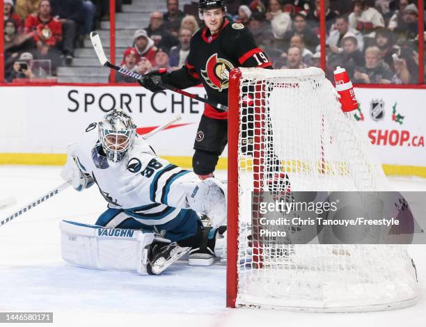 Tim Stützle of the Ottawa Senators scores against Kaapo Kahkonen of the San Jose Sharks during the second period of the game at Canadian Tire Centre...