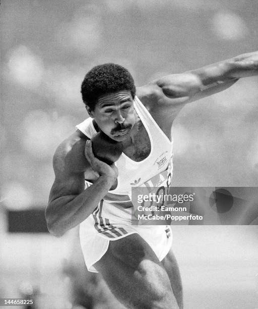 English decathlete Daley Thompson competing in the shot put discipline on the first day of the Men's Decathlon event in the Los Angeles Memorial...