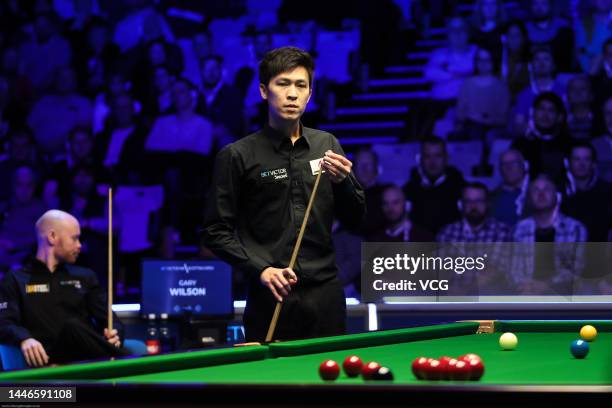 Thepchaiya Un-Nooh of Thailand chalks the cue during the semi-final match against Gary Wilson of England on day 6 of the 2022 BetVictor Scottish Open...