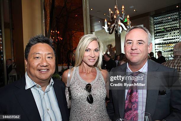 Michael Choe, Jennifer Condas and John Condas during the the 2nd Annual Harvest Summer Food & Wine Event at Charlie Palmer at Bloomingdale's South...