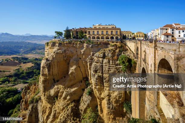 view of the puente nuevo and ronda, malaga, andalusia, spain - costa del sol málaga province stock pictures, royalty-free photos & images
