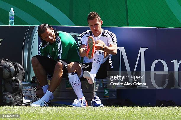 Goalkeeper Tim Wiese and Miroslav Klose prepare for a Germany training session at Campo Sportivo Comunale Andrea Corda on May 17, 2012 in Abbiadori,...