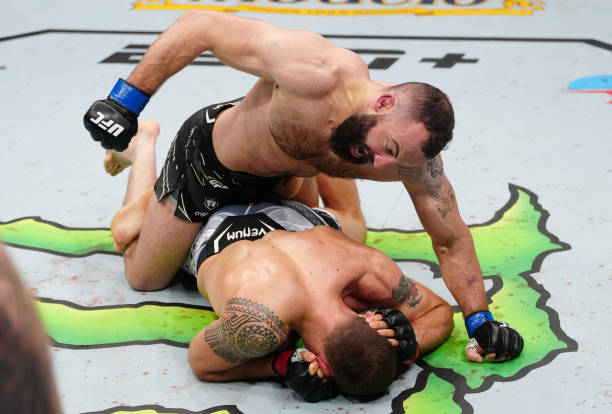 Roman Dolidze of Georgia punches Jack Hermansson of Sweden in a middleweight fight during the UFC Fight Night event at Amway Center on December 03,...