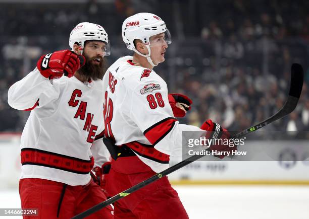 Martin Necas of the Carolina Hurricanes celebrates his power play goal with Brent Burns, to take a 2-0 lead over the Los Angeles Kings, during the...