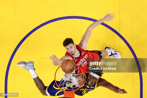 Kevon Looney of the Golden State Warriors goes up for a shot against Alperen Sengun of the Houston Rockets at Chase Center on December 03, 2022 in...