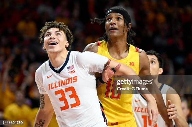 Julian Reese of the Maryland Terrapins boxes out against Coleman Hawkins and RJ Melendez of the Illinois Fighting Illini at Xfinity Center on...