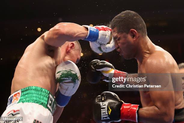 Juan Francisco Estrada of Mexico lands a right on Roman Gonzalez of Nicaragua during their WBC super flyweight title bout at Desert Diamond Arena on...