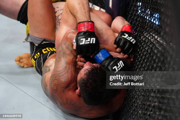 Rafael Dos Anjos of Brazil secures a rear choke submission against Bryan Barberena in a welterweight fight during the UFC Fight Night event at Amway...