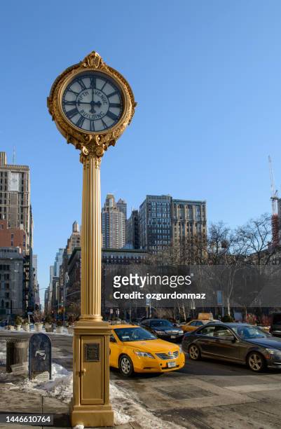 fifth ave building clock and new york city midtown manhattan buildings - 5th avenue stock pictures, royalty-free photos & images