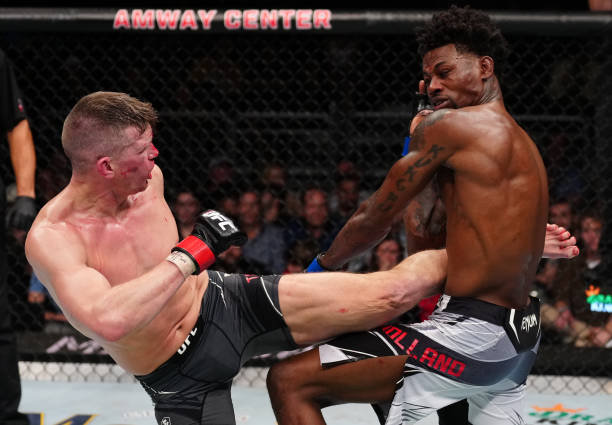 Stephen Thompson kicks Kevin Holland in a welterweight fight during the UFC Fight Night event at Amway Center on December 03, 2022 in Orlando,...