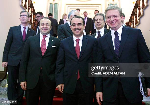 Enlargement Commissioner Stefan Fule , Turkey's Justice Minister Sadullah Ergin and Turkey's EU Affairs Minister Egemen Bagis smile as they walk in...