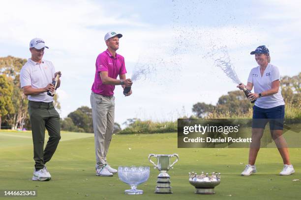 Kipp Popert of England, Adrian Meronk of Poland and Ashleigh Buhai of South Africa celebrate after winning the 2022 ISPS HANDA Australian Open at...