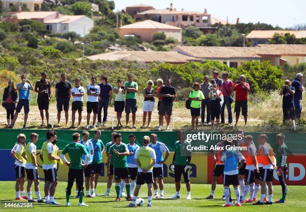 Head coach Joachim Loew talks to players during a Germany training session at Campo Sportivo Comunale Andrea Corda on May 17, 2012 in Abbiadori,...