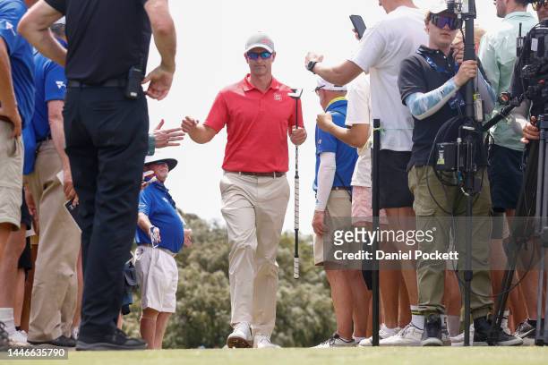 Adam Scott of Australia high fives fans on the way to the next hole during Day 4 of2022 ISPS HANDA Australian Open at Victoria Golf Club on December...