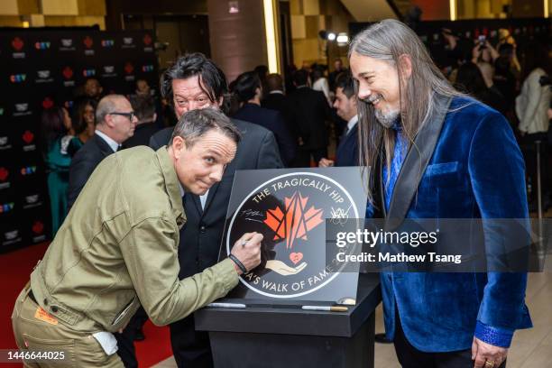 The Tragically Hip attend the unveiling of the band's Canada’s Walk of Fame 2022 commemorative plaque to celebrate their induction for...