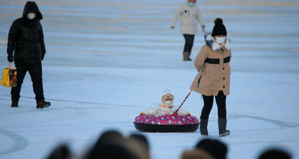 CHN: Citizens Have Fun On Frozen Songhua River In Harbin