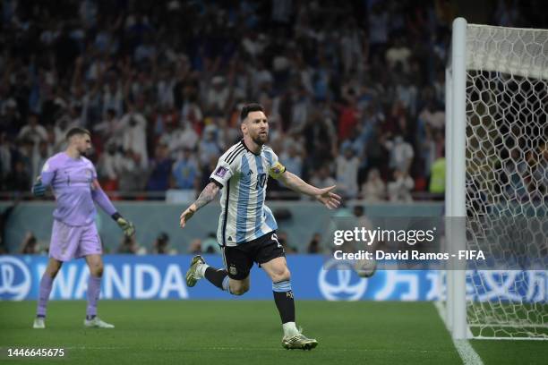 Lionel Messi of Argentina celebrates after scoring the team's first goal during the FIFA World Cup Qatar 2022 Round of 16 match between Argentina and...