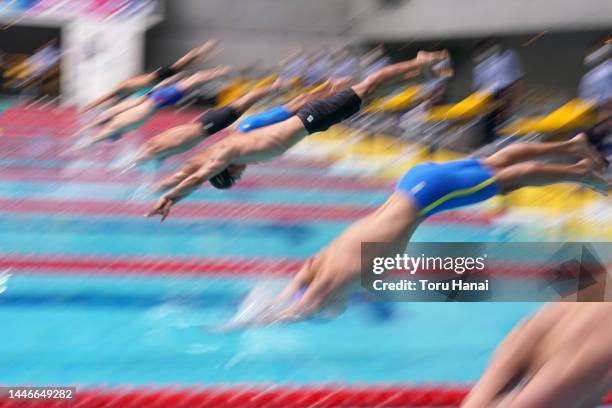 Swimmers leaps from the starting blocks to compete in the Men's 50m Freestyle heats on day four of the Swimming Japan Open at Tokyo Tatsumi...