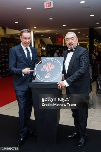 Jeffrey Latimer and Graham Greene attend the unveiling of Graham's Canada’s Walk of Fame 2021 commemorative plaque during the 2022 Canada's Walk of...