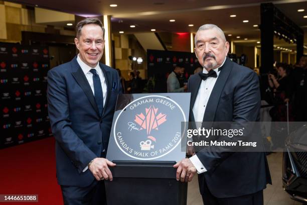 Jeffrey Latimer and Graham Greene attend the unveiling of Graham's Canada’s Walk of Fame 2021 commemorative plaque for Arts & Entertainment during...