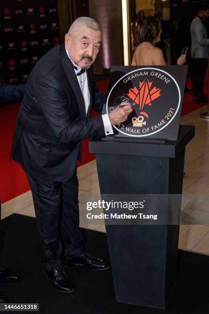 Graham Greene attends the unveiling of his Canada’s Walk of Fame 2021 commemorative plaque for Arts & Entertainment during the 2022 Canada's Walk of...