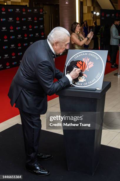 Graham Greene attends the unveiling of his Canada’s Walk of Fame 2021 commemorative plaque for Arts & Entertainment during the 2022 Canada's Walk of...