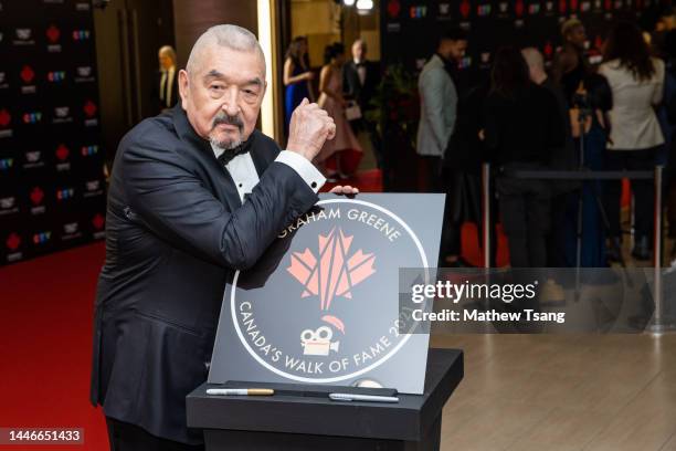 Graham Greene attends the unveiling of his Canada’s Walk of Fame 2021 commemorative plaque for Arts & Entertainment during the 2022 Canada's Walk of...