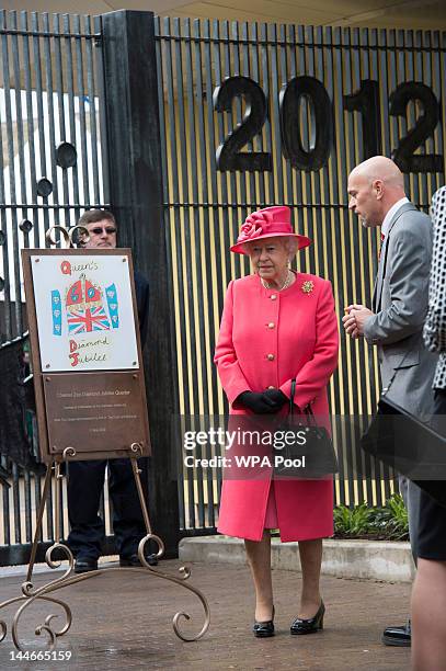 Queen Elizabeth II unveils a plaque to open the Chester Zoo Diamond Jubilee Quarter as she visits Chester Zoo as part of her tour of the North West...