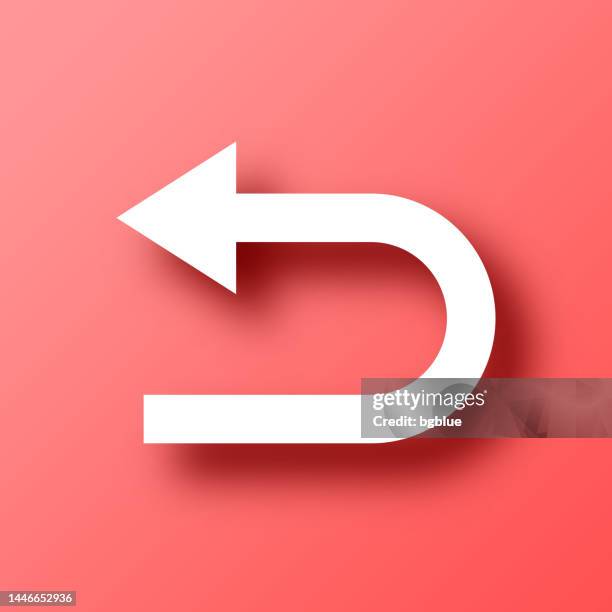 u-turn direction arrow. icon on red background with shadow - turn back stock illustrations
