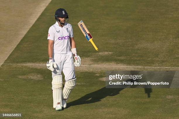 Joe Root of England throws his bat in the air after being dismissed during the fourth day of the first Test between Pakistan and England at...