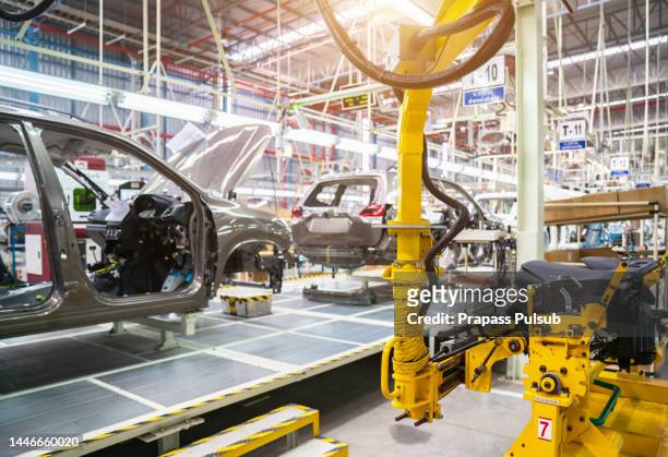 production line in car factory - chassis stock pictures, royalty-free photos & images