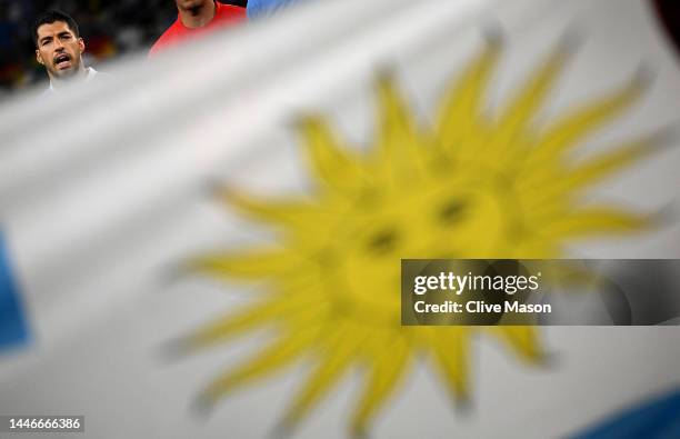 Luis Suarez of Uruguay sings the national anthem as the teams line up ahead of the FIFA World Cup Qatar 2022 Group H match between Ghana and Uruguay...