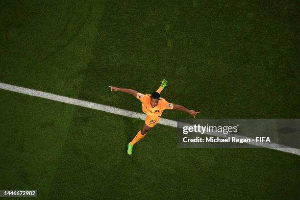 Denzel Dumfries of Netherlands celebrates after scoring the team's third goal during the FIFA World Cup Qatar 2022 Round of 16 match between...