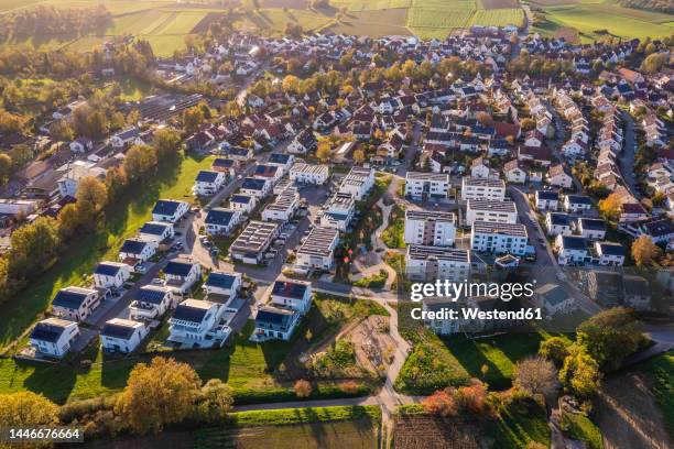 germany, baden-wurttemberg, waiblingen, aerial view of modern energy efficient suburb in autumn - baden baden aerial fotografías e imágenes de stock