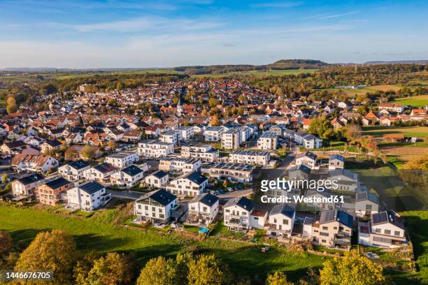 germany, baden-wurttemberg, waiblingen, aerial view of modern energy efficient suburb in autumn - baden württemberg stock pictures, royalty-free photos & images