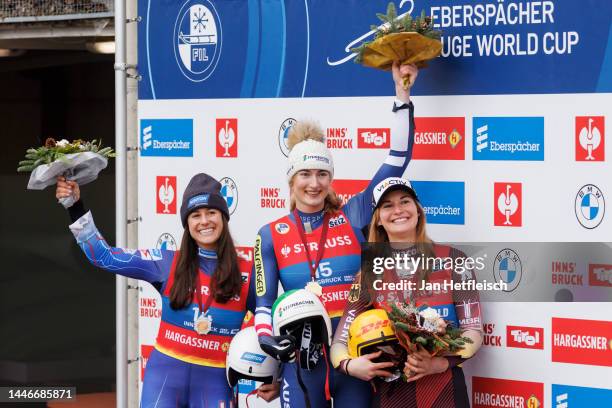 Emily Sweeney of the United States of America, Madeleine Egle of Austria and Julia Taubitz of Germany pose for a picture during the flower ceremony...