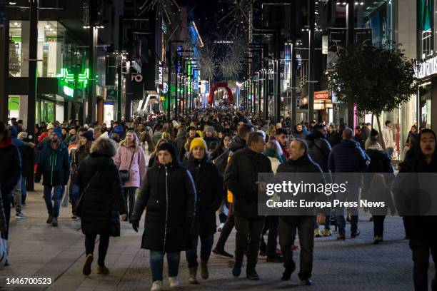 Numerous people stroll along Meritxell Avenue, December 3 in Andorra la Vella, Principality of Andorra. The tourist movement in the Principality of...