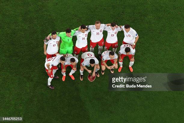 Poland players line up for team photos prior to the FIFA World Cup Qatar 2022 Round of 16 match between France and Poland at Al Thumama Stadium on...