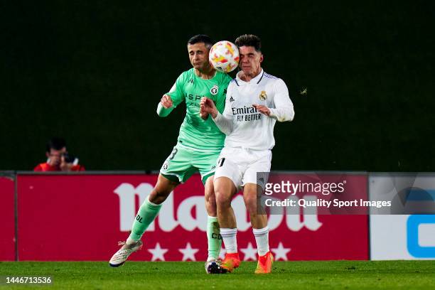 Sergio Arribas of Real Madrid Castilla battle for the ball with Jesus Alvarez of Cultural Leonesa during a game of Primera Federacion match between...