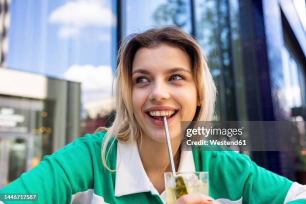 happy woman having drink with stainless steel straw - metal drinking straw stock pictures, royalty-free photos & images