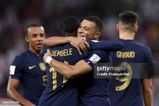 Kylian Mbappe of France celebrates with Ousmane Dembele after scoring the team's second goal during the FIFA World Cup Qatar 2022 Round of 16 match...