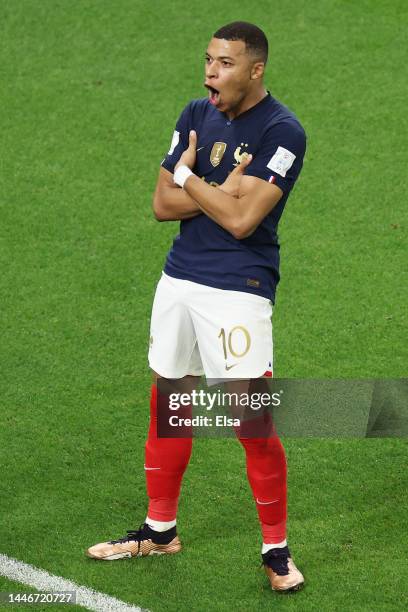 Kylian Mbappe of France celebrates after scoring the team's third goal during the FIFA World Cup Qatar 2022 Round of 16 match between France and...