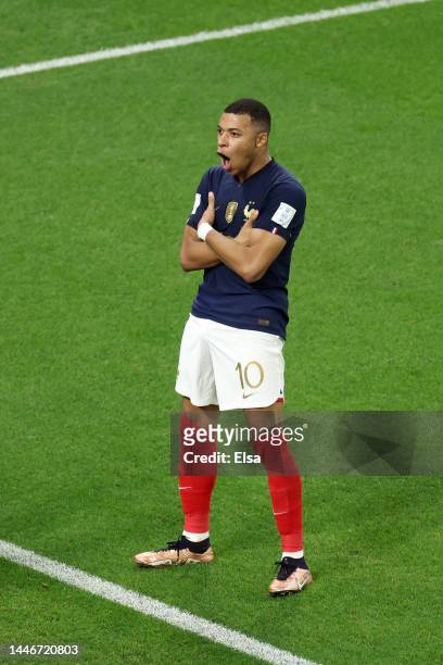 Kylian Mbappe of France celebrates after scoring the team's third goal during the FIFA World Cup Qatar 2022 Round of 16 match between France and...