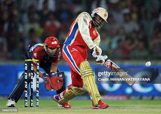 Royal Challengers Bangalore batsman Chris Gayle plays a shot during the IPL Twenty20 cricket match between Delhi Daredevils and Royal Challengers...