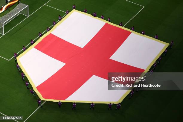 Giant England flag is seen on the pitch prior to the FIFA World Cup Qatar 2022 Round of 16 match between England and Senegal at Al Bayt Stadium on...