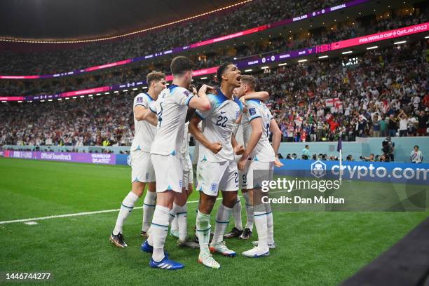 Jordan Henderson of England celebrates with teammates after scoring the team's first goal during the FIFA World Cup Qatar 2022 Round of 16 match...
